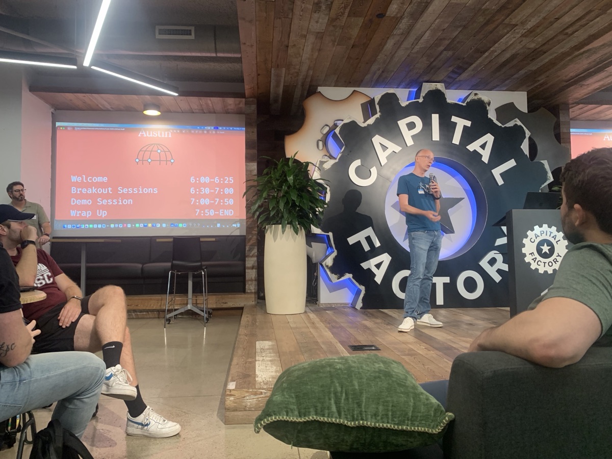 Evening tech event at Capital Factory Austin — speaker on stage with audience