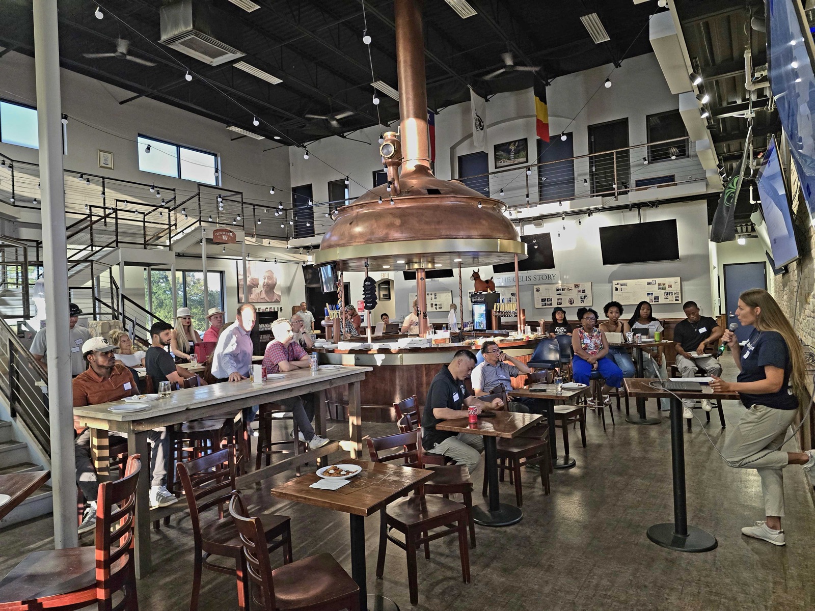 A full room watching live MakerSquare demos at Celis Brewery in Austin